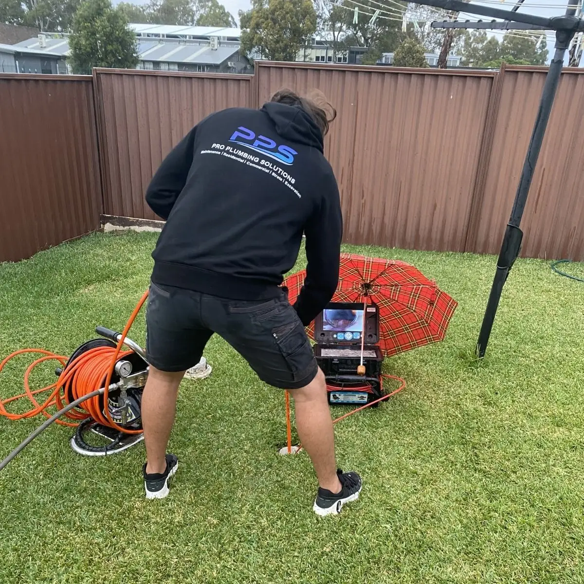 Plumber unblocking Sydney drains to relieve plumbing problems